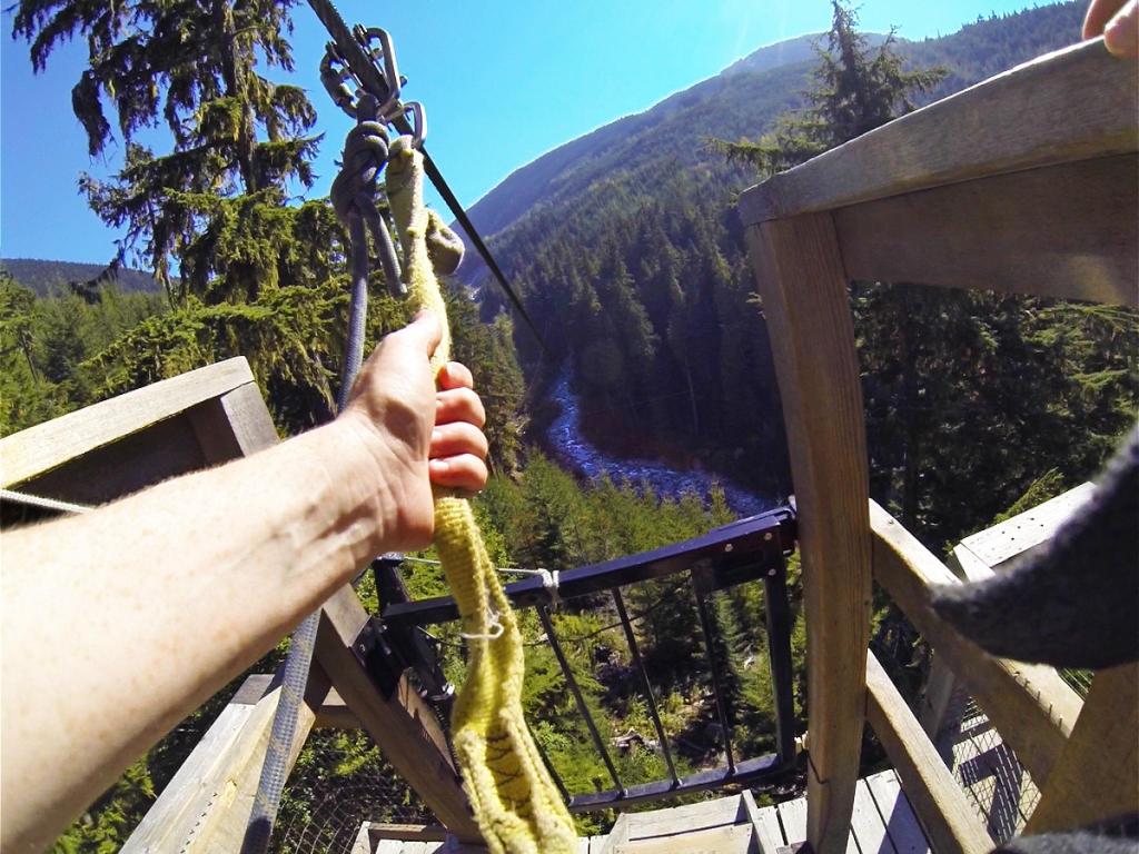 Sara getting ready to fly over Fitzsimmons Creek on a zipline near Whistler