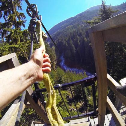 Sara getting ready to fly over Fitzsimmons Creek on a zipline near Whistler